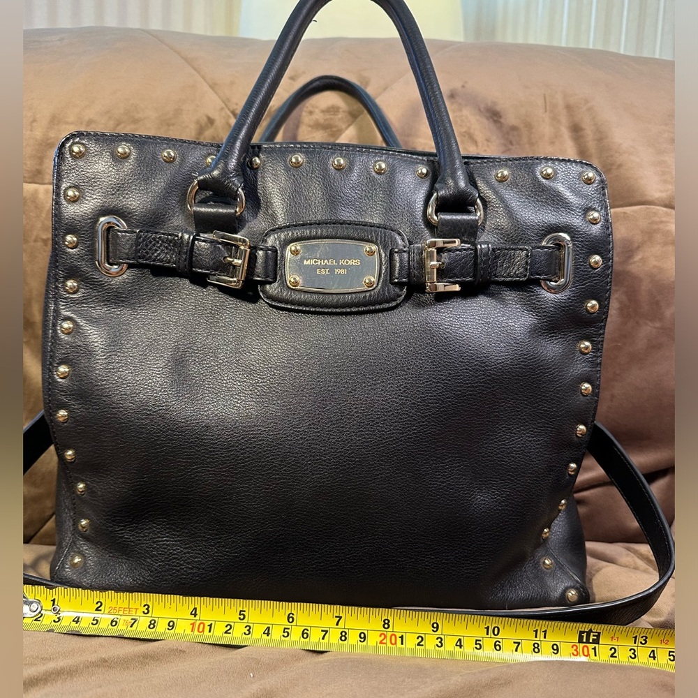 Michael Kors black tote with grommets and shoulder strap